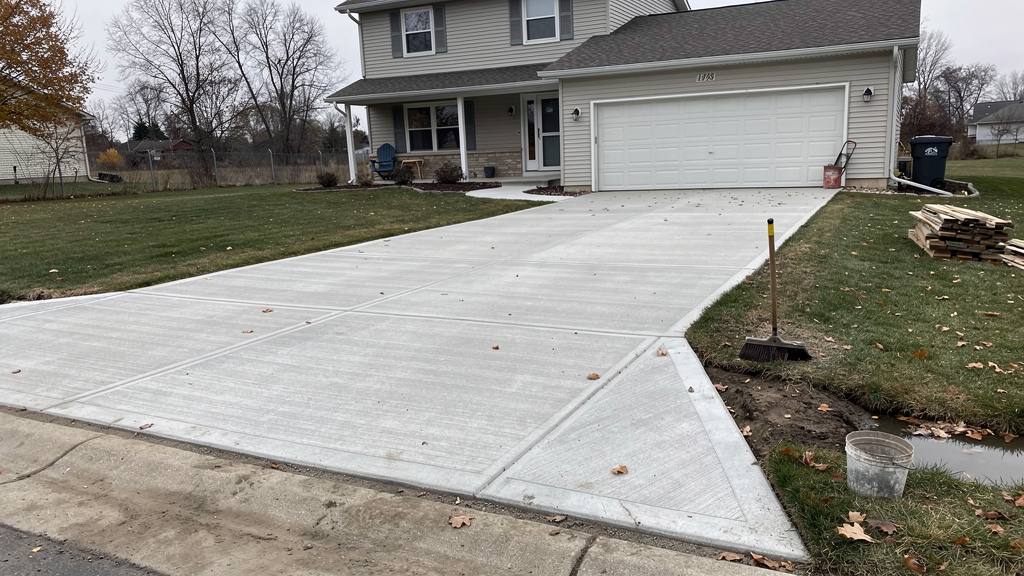 Concrete driveway edge with a prepared gravel base